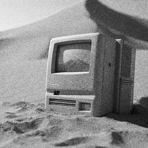 PES Motion Studio artwork: vintage computer half-buried in desert sand